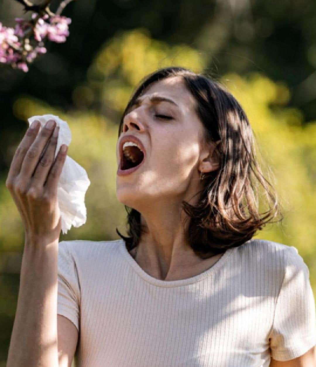 A woman sneezing: want allergy relief?